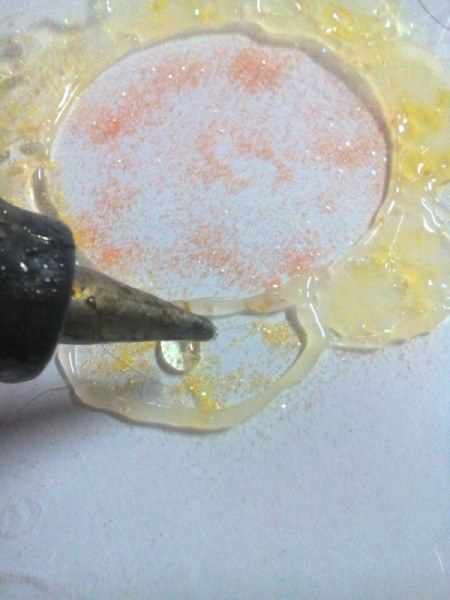 Glittered Glass Coaster Made from Hot Glue - fill in the entire design with hot glue