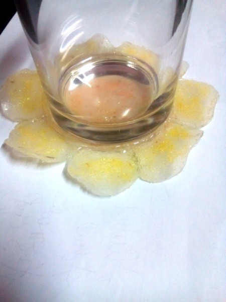 Glittered Glass Coaster Made from Hot Glue - glass on coaster after creating a glue ring for the glass to sit inside of