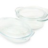 A set of glass cookware with lids.