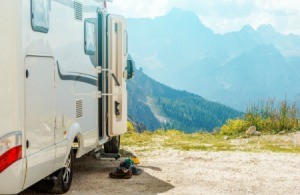 A motorhome parked in the mountains.