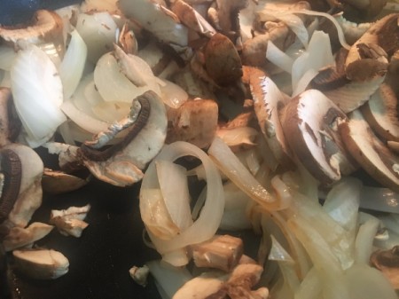 chopped onions and peppers in pan