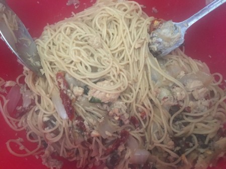 mixing in cooked pasta