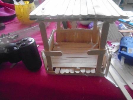 Popsicle Stick Gazebo and Bench - glue cut sticks to front roof supports