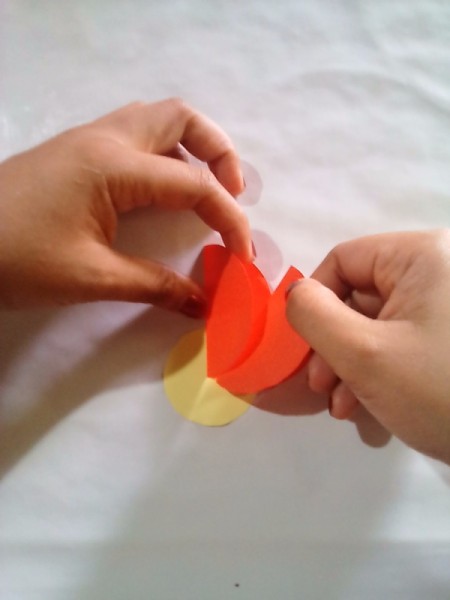 Making Folded Circle Paper Flowers - adding next folded circle