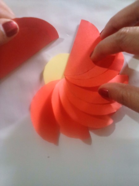 Making Folded Circle Paper Flowers - continuing to glue folded circles