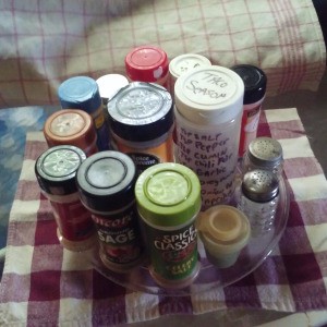 A collection of spices on a glass tray, used in a microwave.