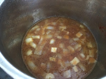 adding broth to Pressure Cooker