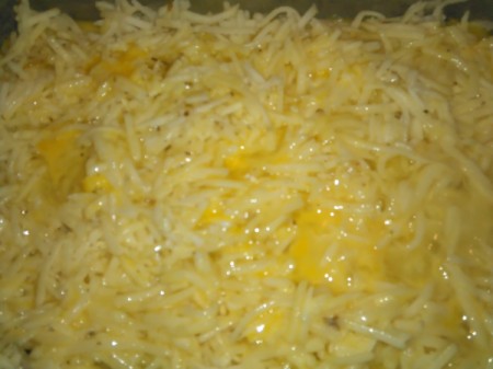 Beaten eggs poured over hashbrowns