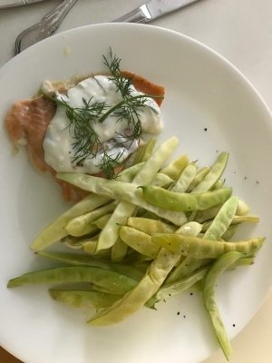 Baked Salmon with Dill Sauce and beans on plate