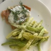 Baked Salmon with Dill Sauce and beans on plate
