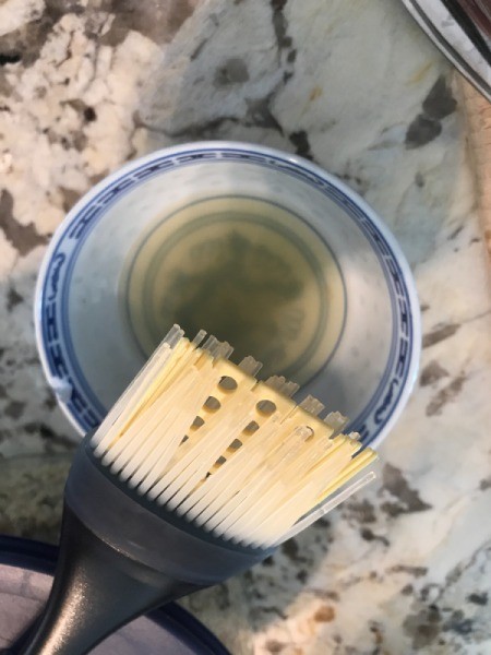 Oil and a brush, for preparing the grilled artichokes.