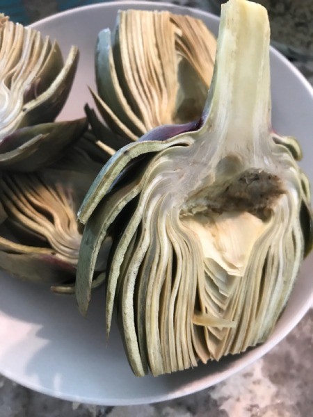 The artichoke halves, ready for grilling.