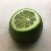 A lime section with the pointy end cut off.