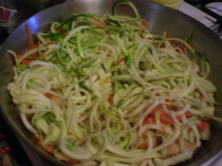vegetables and noodles added to chicken