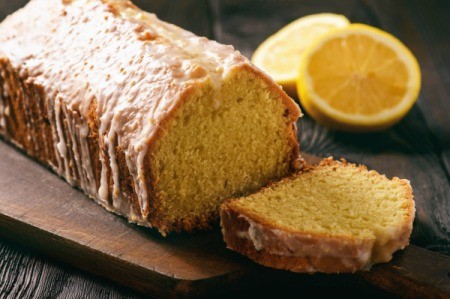 Homemade lemon loaf on a cutting board.