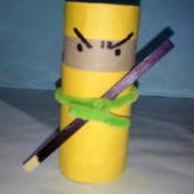 A completed ninja made from a recycled toilet paper roll.