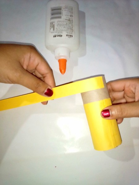 Gluing on the strip for the head.