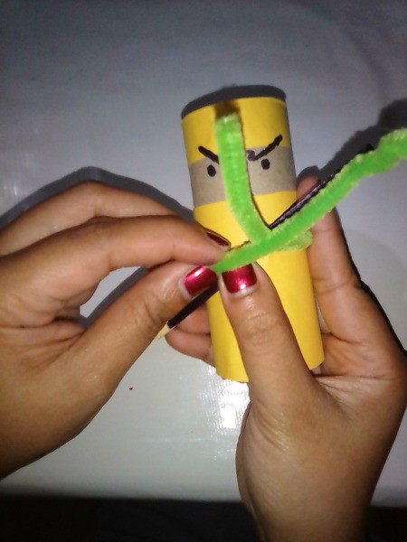 Using a green pipecleaner as a belt for the ninja.