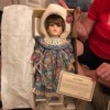 Value of a Seymour Doll - doll wearing a floral dress and hat in box