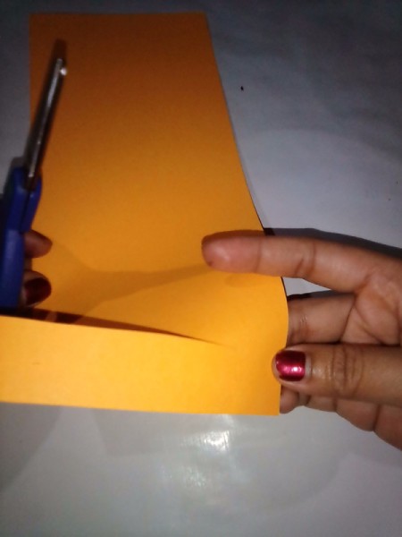 Making a Paper Lantern - begin making cuts toward the folded edge leaving approximately 2cm uncut
