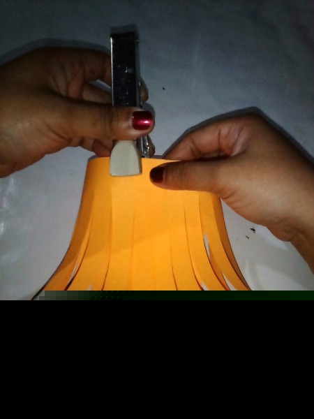 Making a Paper Lantern - bring ends together and staple top and bottom
