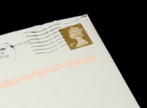 An old post marked envelope with a postage stamp on it.