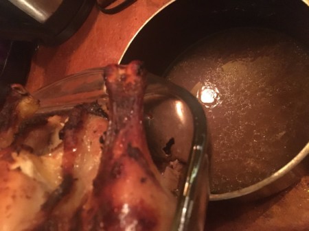 Jammy Roast Chicken - pouring Roast Chicken juices