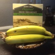 A box of Irish Breakfast tea and three bananas.