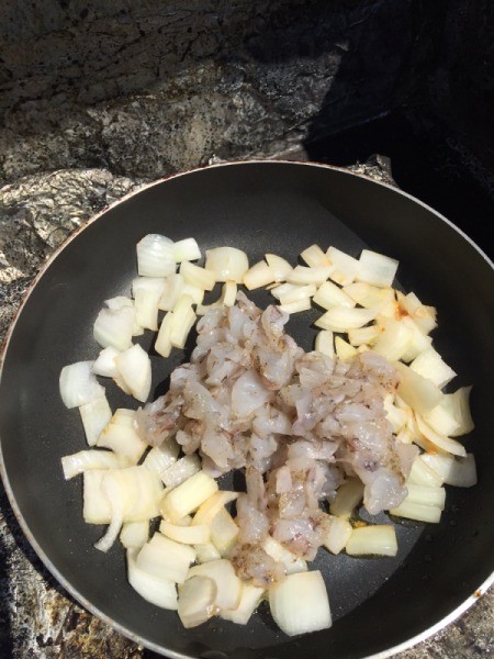onion and shrimp in pan
