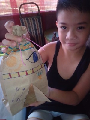 Paper Bag Tent - young boy holding the finished tent