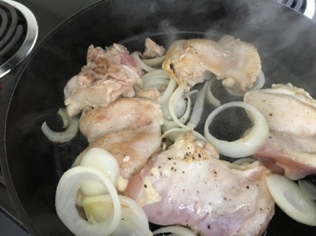 cooked chicken and onions in skillet