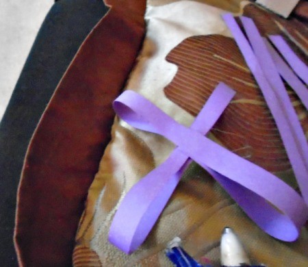 Making Pretty Paper Bows - glue first two together in an X shape