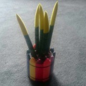 Identifying a Houseplant - odd looking plant in planter with crayon motif around outside