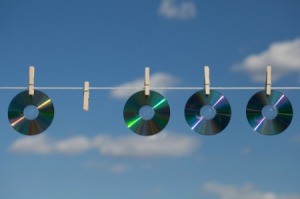 CDs Hanging on Clothesline to Keep Birds Out of Garden