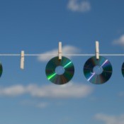 CDs Hanging on Clothesline to Keep Birds Out of Garden