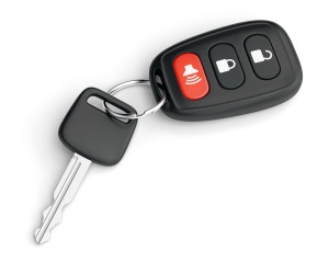A car with with key fob that has a red panic button.