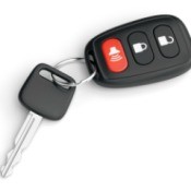 A car with with key fob that has a red panic button.