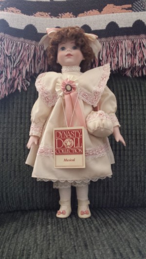 Value of a Musical Dynasty Doll - doll wearing a pink period dress