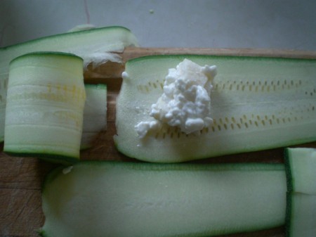 Zucchini with cheese ready to roll up