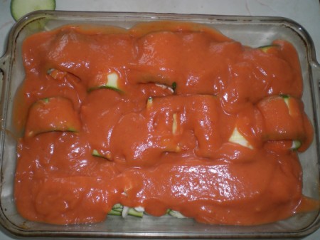 Zucchini Manicotti Rollin baking dish covered with pasta sauce