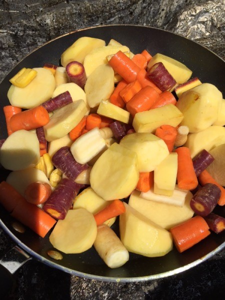 Carrot and potatoes in pan