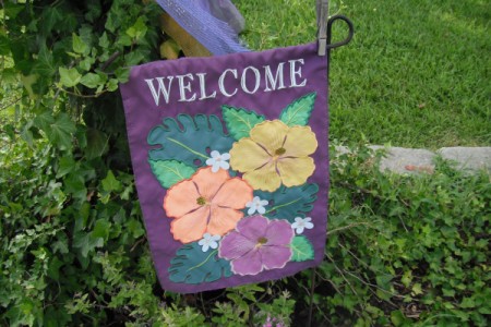 A garden flag secured by a clothespin