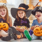 Three kids wearing cute costumes.