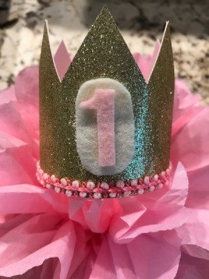 Birthday Crown - finished crown sitting on top of a pink tissue paper flower