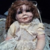 Identifying a Legacy Porcelain Doll - doll wearing yellow dress