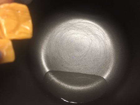 Caramel added to water in pan