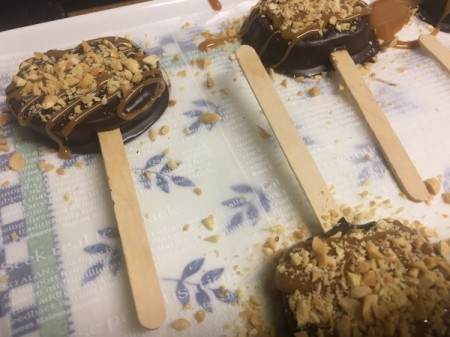 chopped peanuts on Caramel Apple Slice Pops