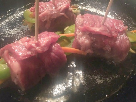 Balsamic Steak and Veggie Rolls cooking in pan