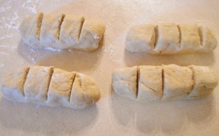 logs of dough cut in quarters