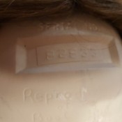 Identifying a Porcelain Doll Based on a Serial Number - number on doll's head